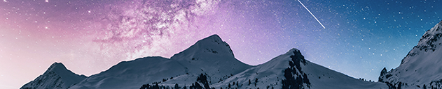 Snow capped mountains with shooting star above